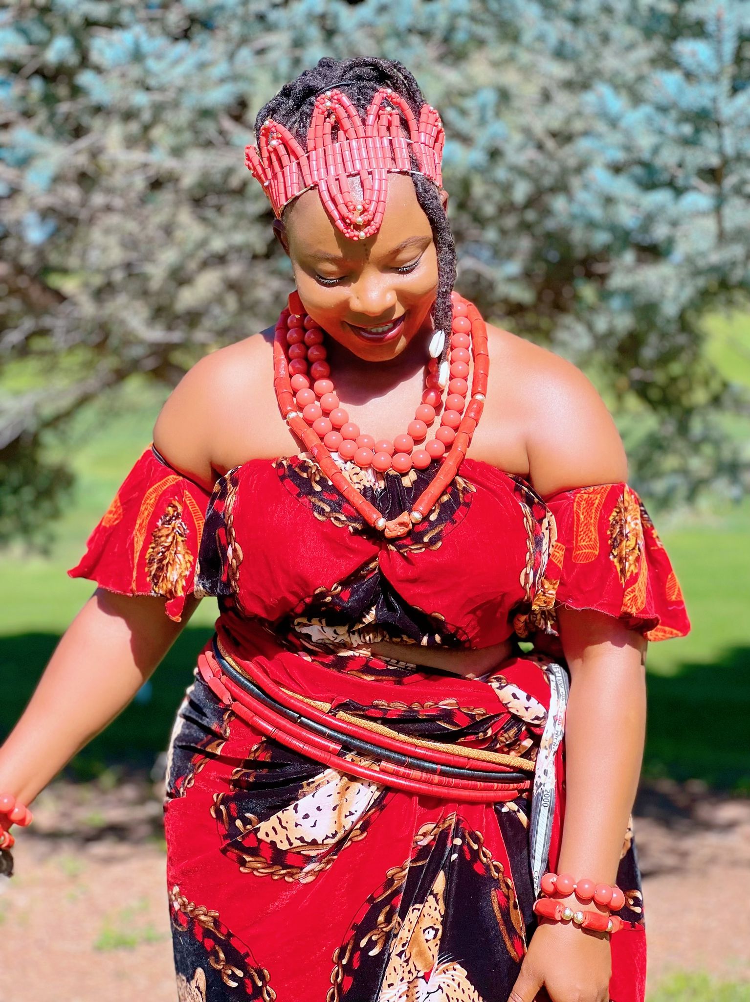 An Igbo Bride fully bedecked in her Isi-Agụ Regalia